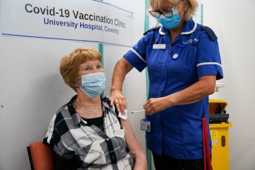 Briton who had world’s first Covid jab receives her booster shot