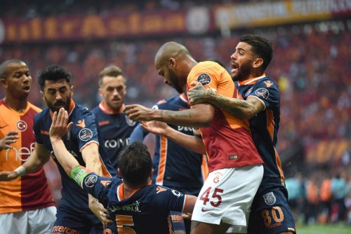 Chaotic scenes in Istanbul as Galatasaray and Basaksehir players clash in touchline melee during title-decider