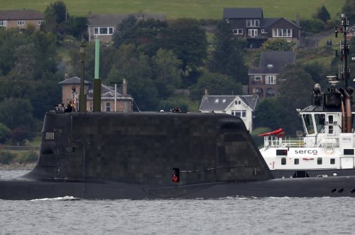 Wallace attempts to downplay submarines row as France minister postpones meeting