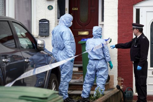 Two boys found dead at home with their mother had been strangled, inquest told