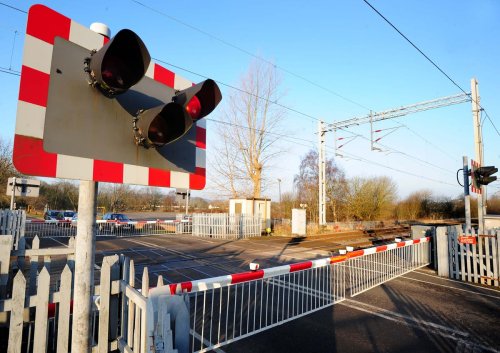 Railway lines blocked after train hits car at level crossing