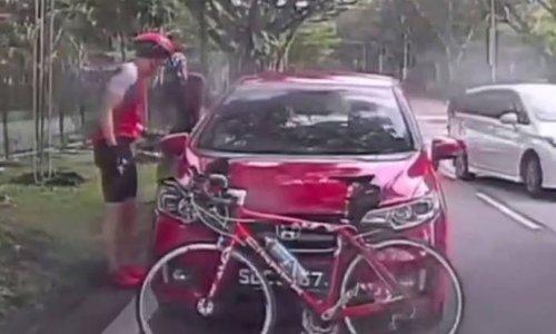 Cyclist blocks car with his bicycle to confront driver for allegedly honking at him