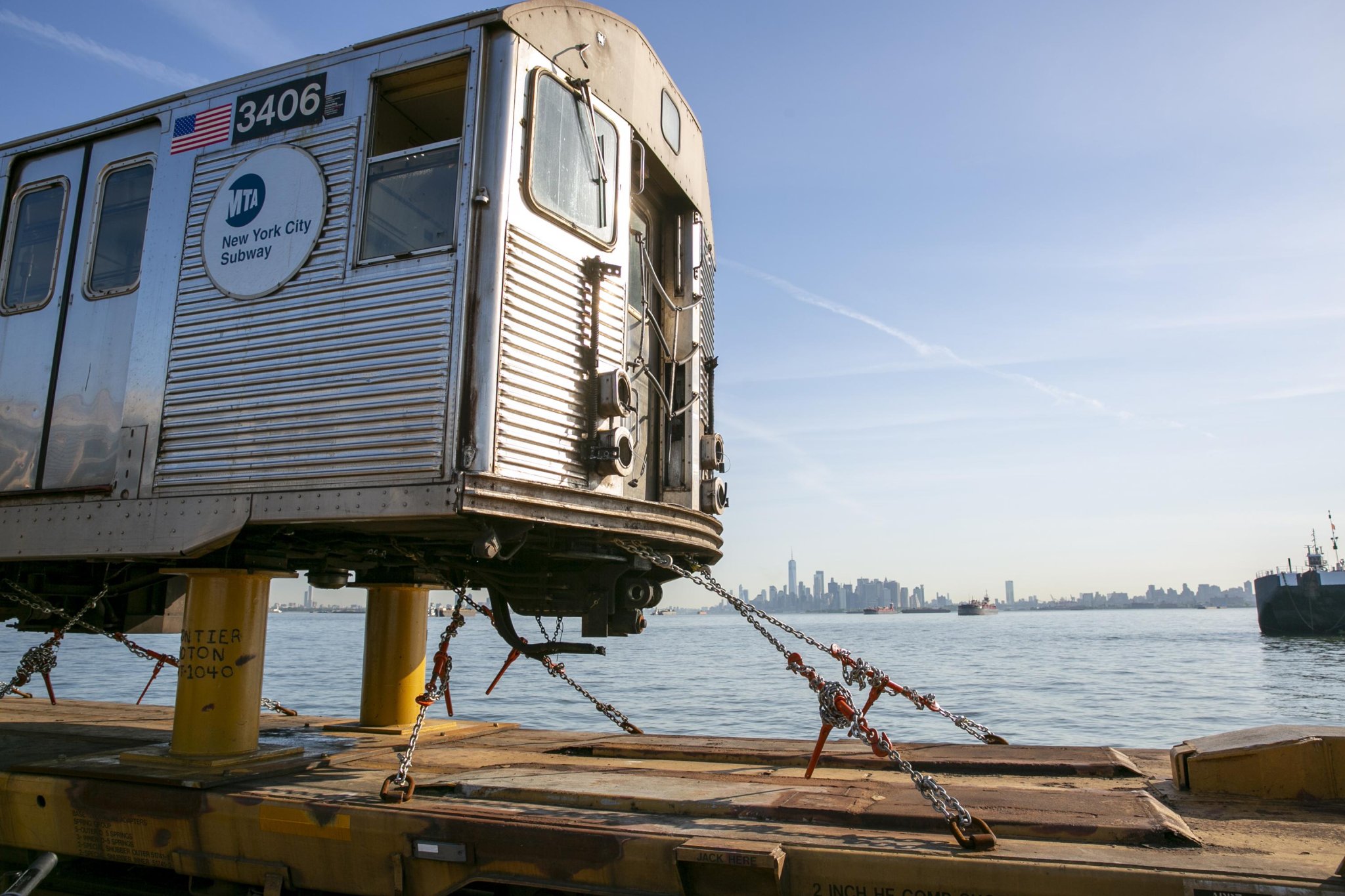 Bon voyage: Old subway cars float off across New York Harbor