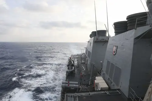 China threatens consequences over US warship's actions