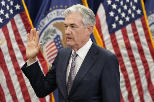Fed officials signal rates may head to 'restrictive' levels