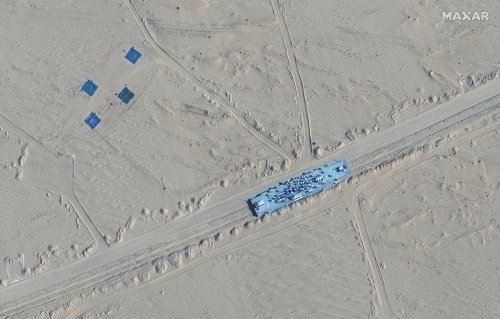 Satellite images show China built mock-ups of US warships