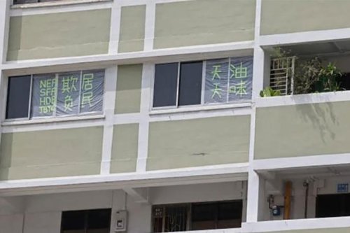 Fed up with fumes from nearby restaurant, Chinatown resident puts up message on flat windows