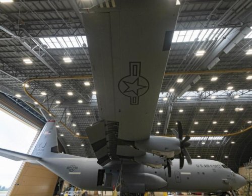 The C-130J Super Hercules with new tail flash stripe