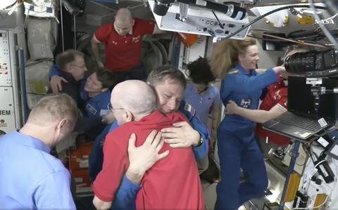 NASA’s stuck astronauts welcome their newly arrived replacements to the space station
