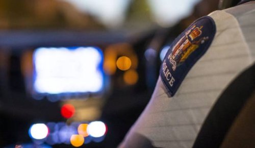 One dead in Auckland crash after car rolls, hits building