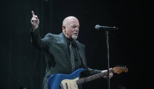 Billy Joel still has the power to bring 35,000 to their feet in song - 'just stay in key, OK?'