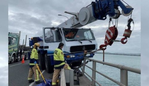 Truck carrying crane crashes on Tauranga Harbour Bridge