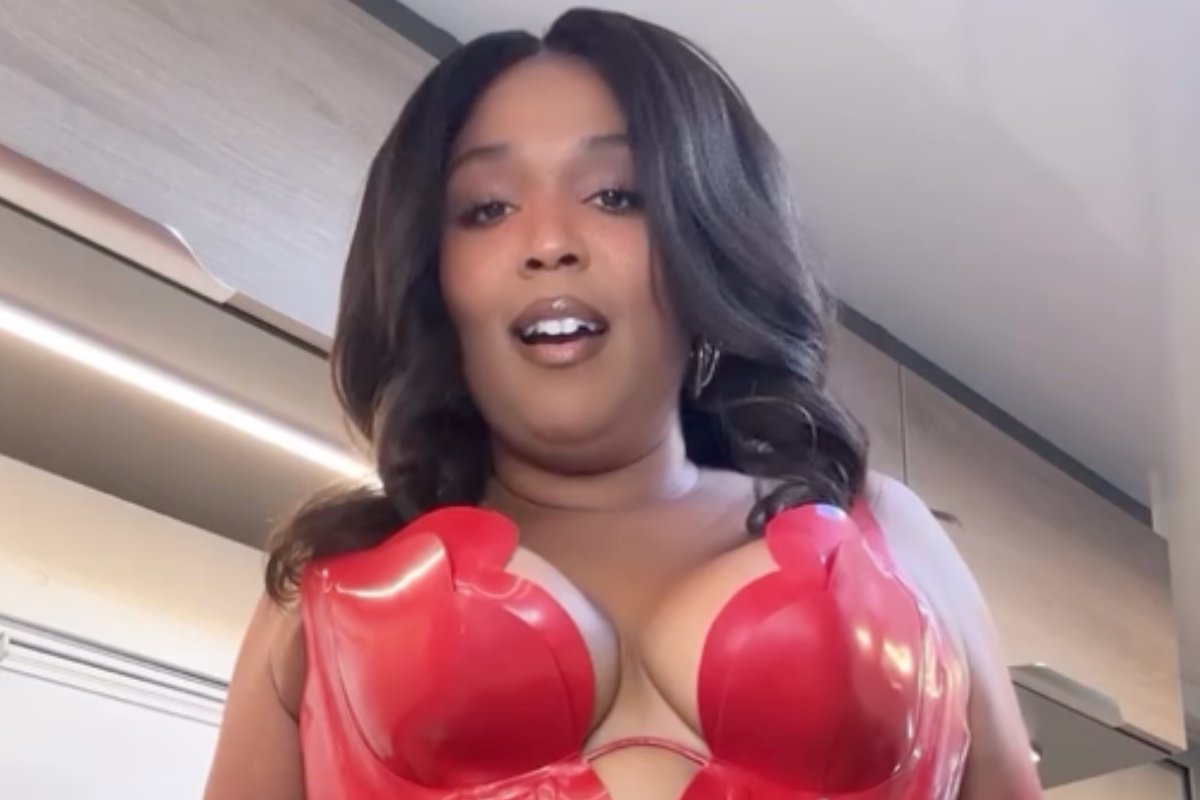 Lizzo Flaunts Weight Loss in Bold Red Vinyl Look with See-Through Flair