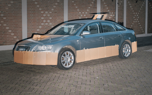 Artist roams streets at night turning strangers' parked cars into absurd supercars