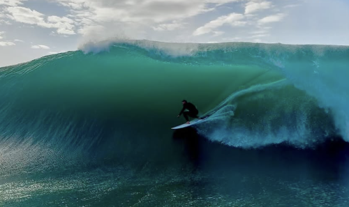 Chris Hemsworth Surfs “Insane” Wave During Deadly Huge Swell