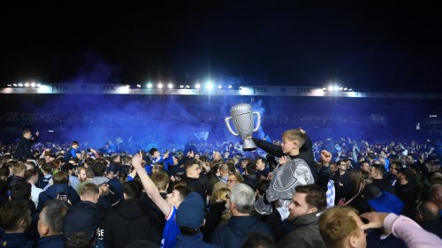 Portsmouth fans storm Fratton Park pitch as supporters celebrate promotion