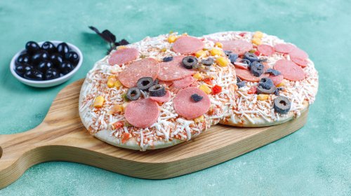 Why You Should Add Toppings To Frozen Pizza After It's Done Cooking