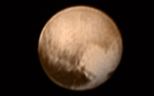 Pluto flyby - as it happened: First pictures show dwarf planet is red like Mars