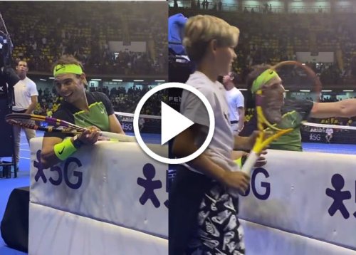 Rafael Nadal makes a kid play against Casper Ruud during exhibition in South America