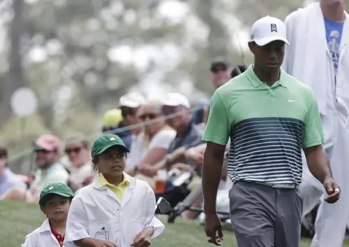 Tiger Woods back as a caddie for his Charlie