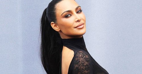 Kim Kardashian shrugs off Kanye call-out in figure-hugging lace for Paris show