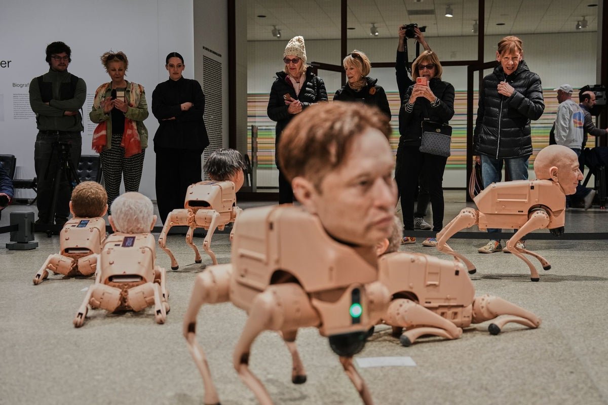 Robot dogs with Elon Musk and Mark Zuckerberg heads roam gallery in new Beeple art exhibit