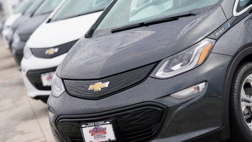 STANDSTILL Shortage of EV chargers leaves Chevy Bolts sitting unused in parking lot after being discontinued by General Motors