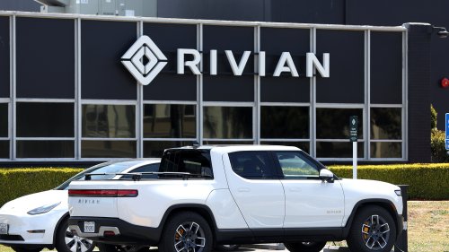 SEEING RED ‘Competition is dying’ Tesla fans say after EV rival Rivian’s bombshell announcement about layoffs and scaling back