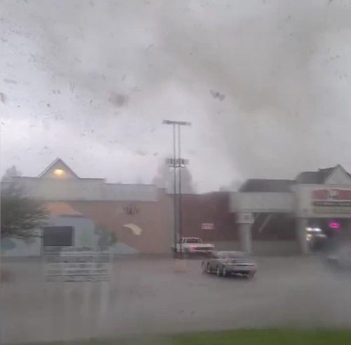 Shock moment couple desperately tries to outrun tornado and cowers for cover