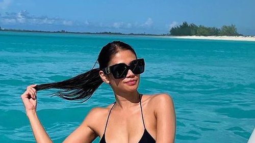 UFC Octagon girl Red Dela Cruz looks sizzling in tiny bikini while lounging on boat as she gives insight into vacation