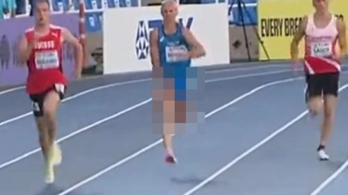 Awkward moment athlete covers his manhood after popping out of his shorts