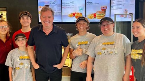 Piers Morgan 'gets mistaken for Brad Pitt' as he poses with fans at McDonald's