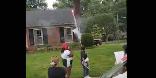 'This is our street, motherf***er!': Protesters shoot fireworks toward district attorney's home on July 4, block streets, burn American flag | Blaze Media