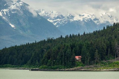 Remote resident shares stunning photos of off-grid home nestled in mountains: 'It's all worth it'