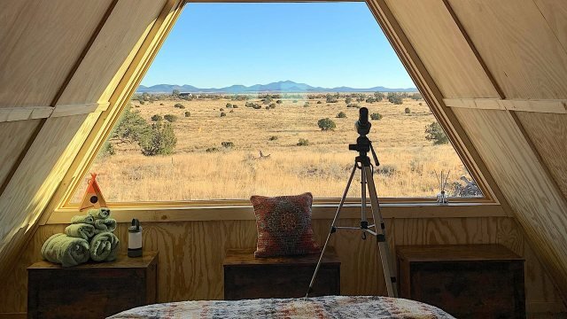 Off-grid homeowner shows off images of incredible, fully furnished tiny new home for $38,000: 'It's so striking'