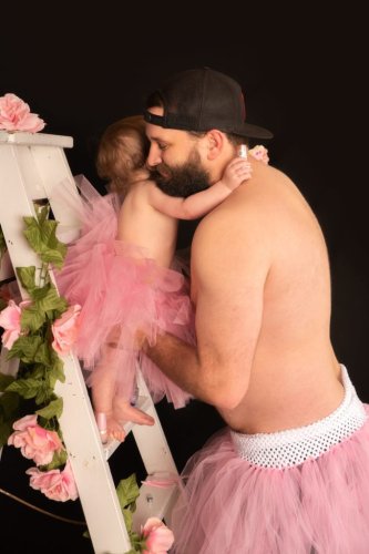 Dad and Baby Daughter Sport Matching Tutus for Epic Photoshoot