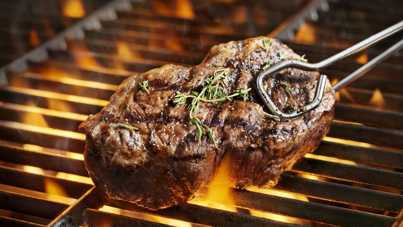 Why It Can Pay Off To Grill Your Steak Straight From The Freezer