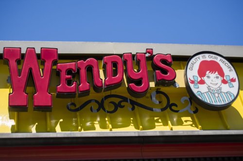 man taking bath in wendy's kitchen sink