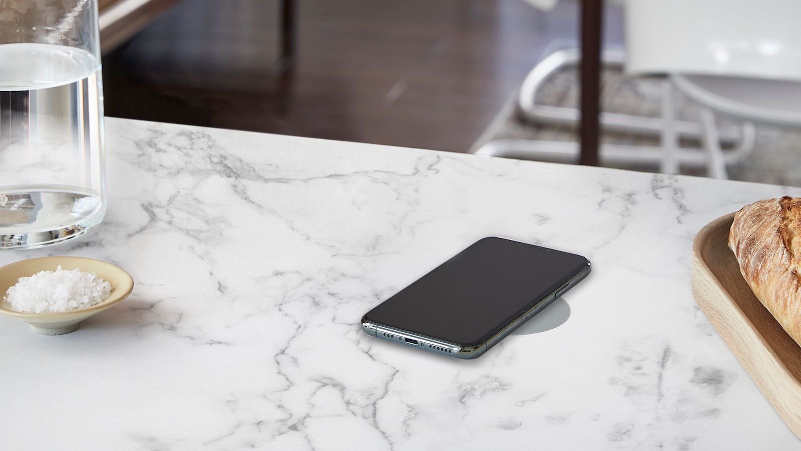 Humanscale NeatCharge 10 W wireless charger subtly attaches to the bottom of a desk