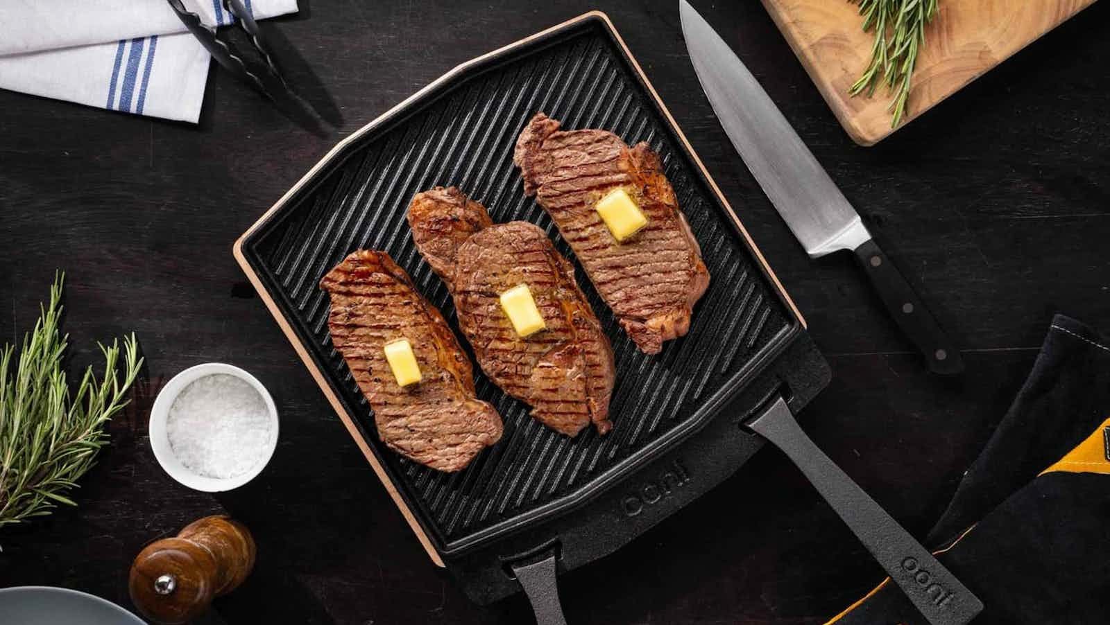 Ooni Dual-Sided Grizzler Plate features a smooth side and a griddle side for versatility