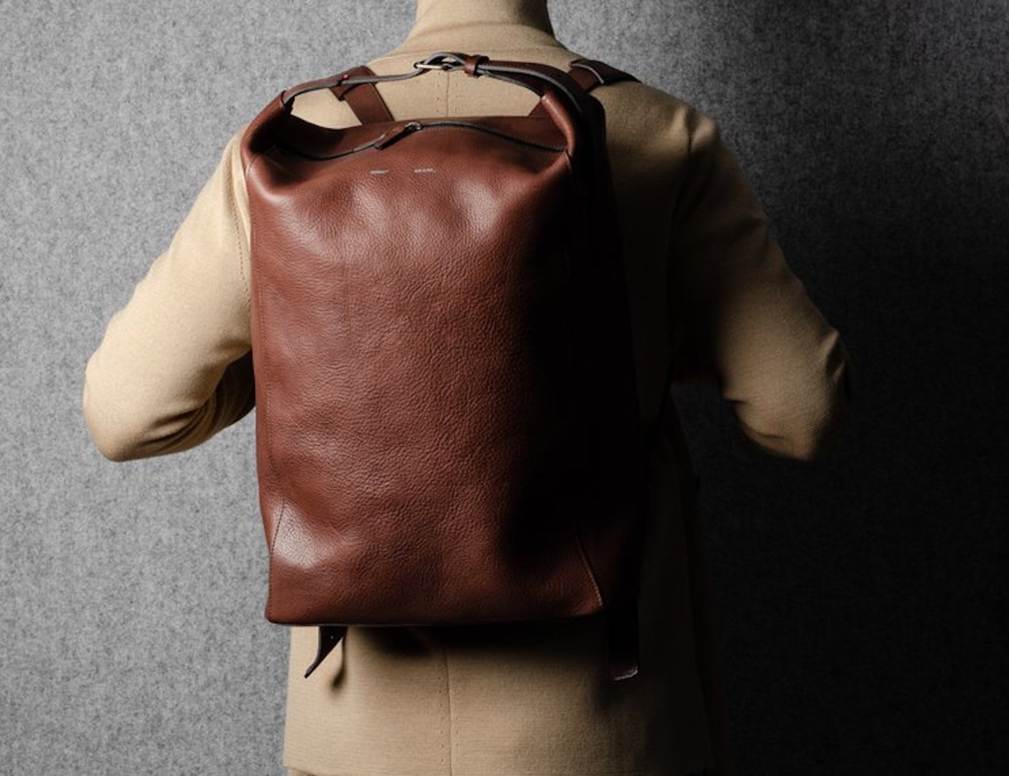 hardgraft Chestnut belted leather backpack has a padded laptop compartment