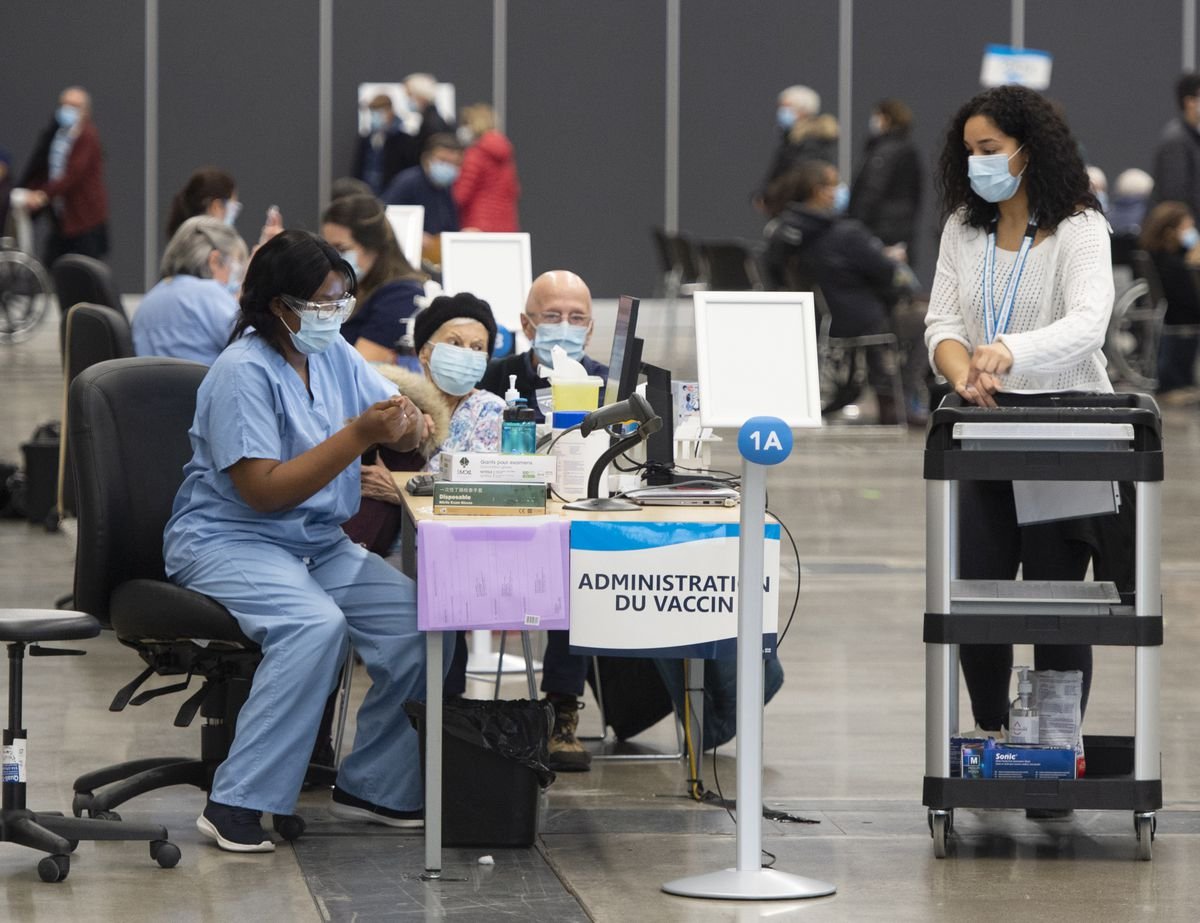 Grumbling about delays as mass COVID-19 vaccinations begin in Montreal