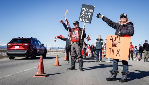 Carbon price protesters slow traffic on Trans-Canada Highway west of Calgary