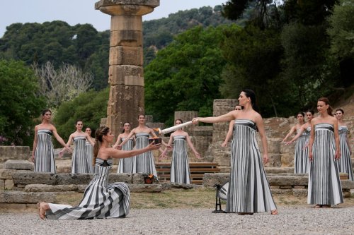 Despite weather glitch, flame for Paris Olympics lit at site of ancient games in southern Greece