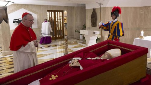 Vatican releases first video images of Pope Francis in coffin with cardinals offering prayers