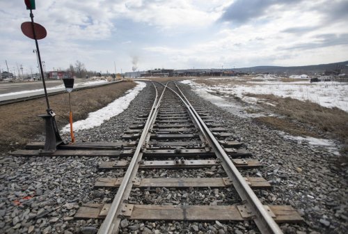 Woman dozes off on train tracks, escapes injury as train screeches to halt