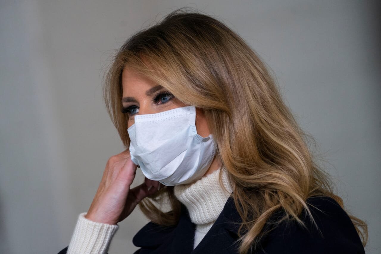 Melania Trump breaks virus protocol at children's hospital by removing mask