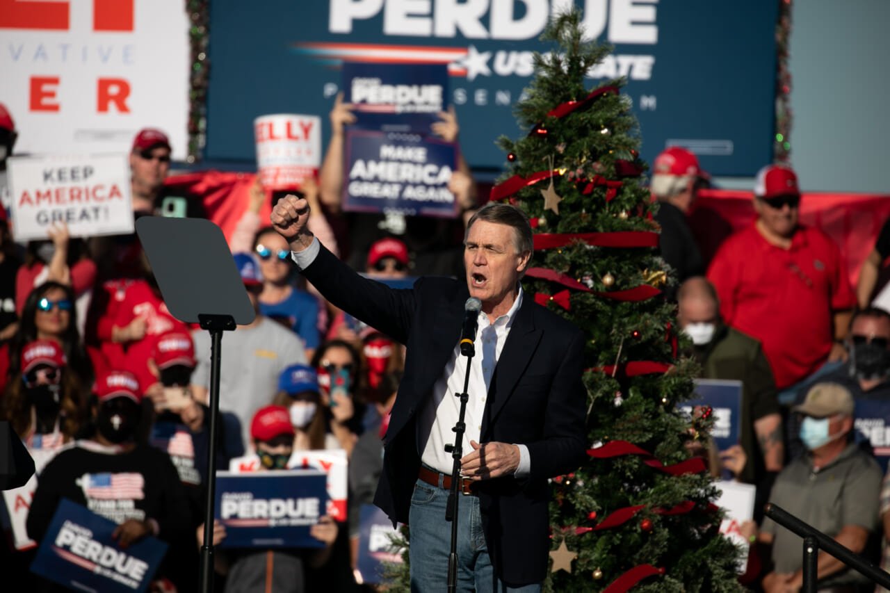 AOC took a savage jab at David Perdue on Twitter. Here's how he responded.