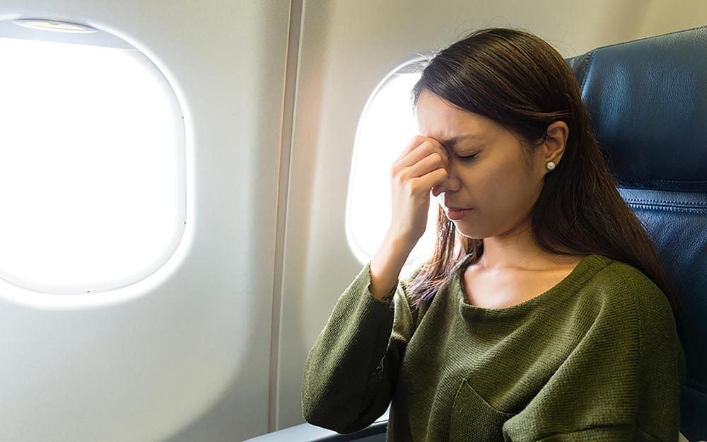 10 Smart Tricks to Avoid Getting Sick on Long Flights