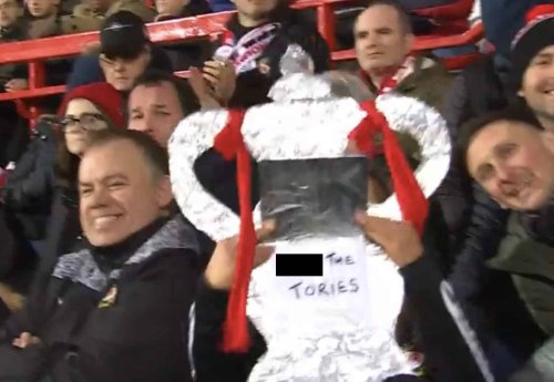 Cheeky! Wrexham fan sneaks 'F*** the Tories' sign onto BBC broadcast